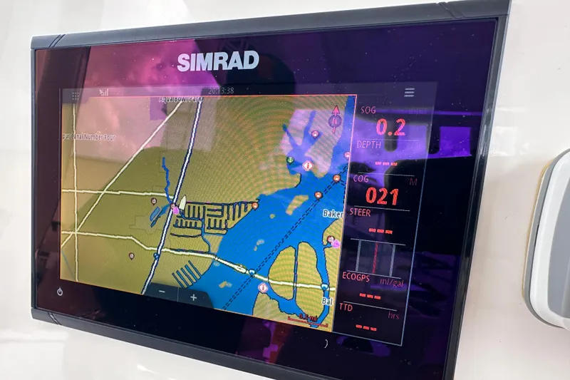 Slide: The Image of Simrad navigation display on 2020 NauticStar 25 XS boat showing map and data. - 47