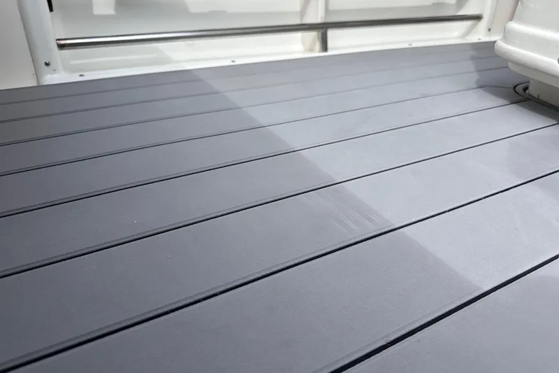 Slide: The Image of Deck of 2020 NauticStar 25 XS boat with sleek, modern design. - 49