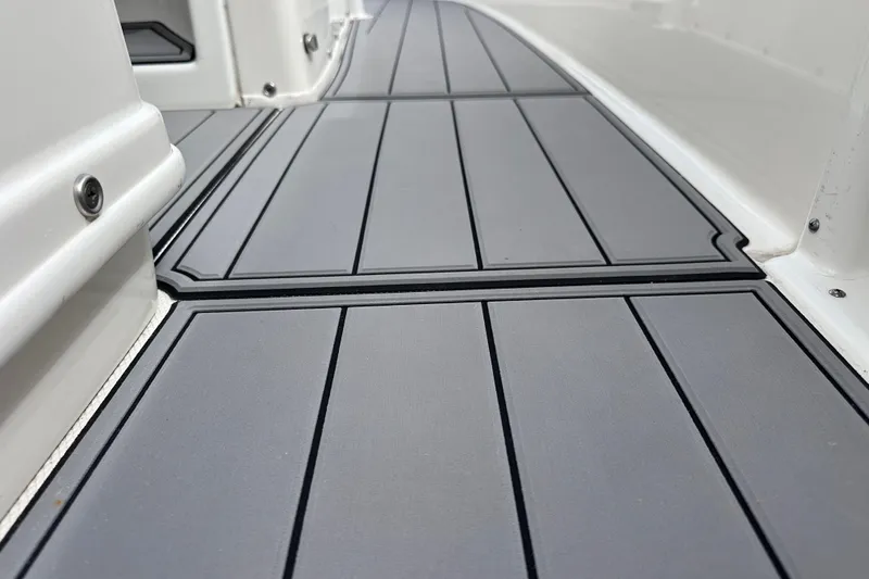 Slide: The Image of Gray deck flooring on 2020 NauticStar 25 XS boat, showcasing sleek design and durability. - 50