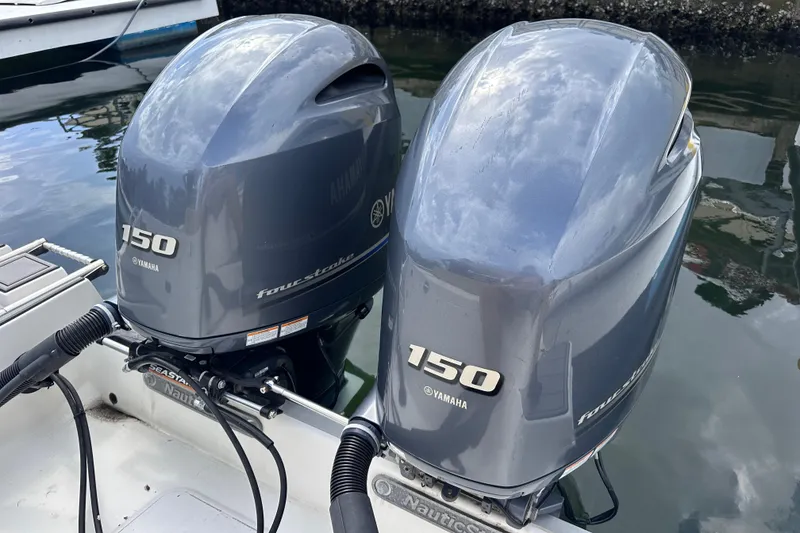 Slide: The Image of Twin Yamaha 150 outboard engines on a 2020 NauticStar 25 XS boat. - 61