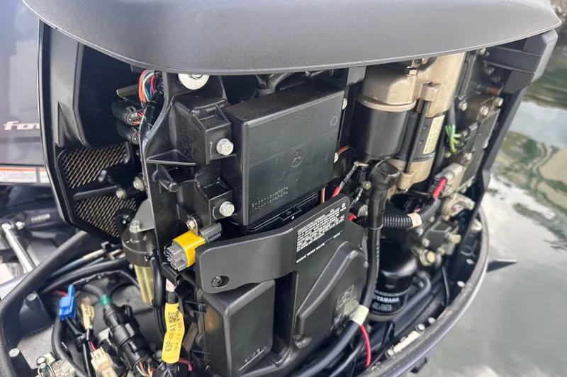 Slide: The Image of Close-up of a 2020 NauticStar 25 XS boat engine components. - 65