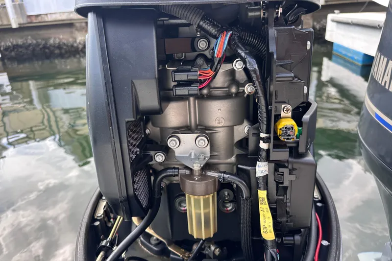 Slide: The Image of Close-up of a 2020 NauticStar 25 XS boat engine components. - 68