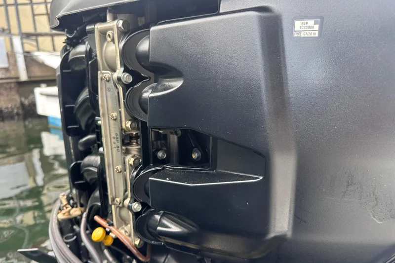 Slide: The Image of Close-up of a 2020 NauticStar 25 XS boat engine detail. - 71