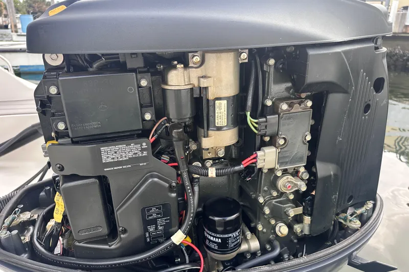 Slide: The Image of 2020 NauticStar 25 XS boat engine close-up, showcasing intricate mechanical components. - 72