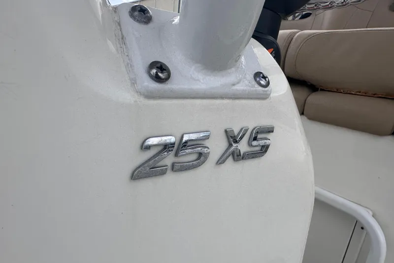 Slide: The Image of 2020 NauticStar 25 XS boat emblem on white surface, showcasing model details. - 82