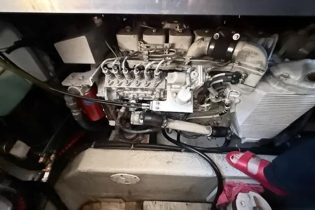 Slide: The Image of Engine compartment of a 1998 Carver 370 Voyager boat, showcasing mechanical components. - 16