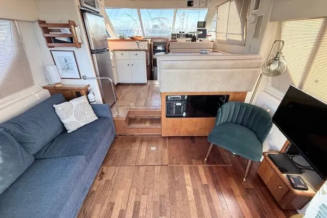 Slide: The Image of Interior of 1998 Carver 370 Voyager yacht with cozy seating and modern amenities. - 2