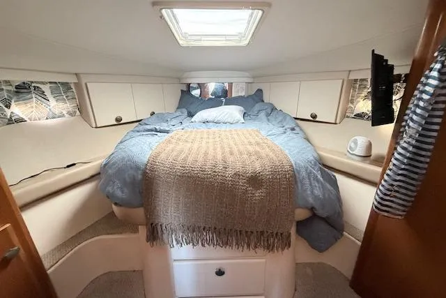 Slide: The Image of Cozy cabin interior of 1998 Carver 370 Voyager with bed and skylight. - 5