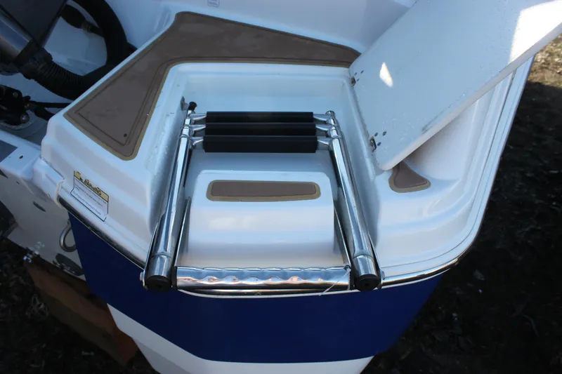 Slide: The Image of 2018 NauticStar 243DC Sport Deck with foldable swim ladder. - 21