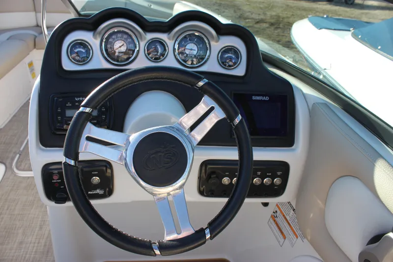 Slide: The Image of Steering wheel and dashboard of 2018 NauticStar 243DC Sport Deck boat. - 9