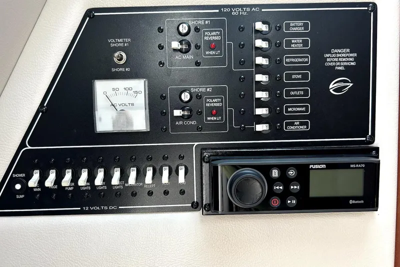 Slide: The Image of Luxurious interior of 2012 Crownline 260 CR boat with plush seating and elegant table. - 12