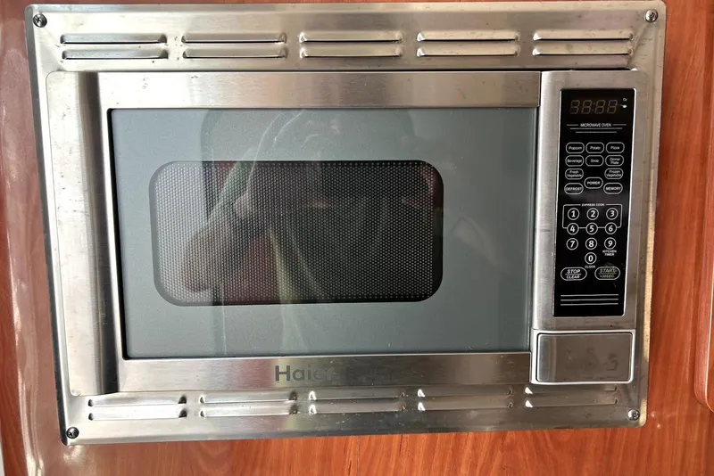 Slide: The Image of Interior view of 2012 Crownline 260 CR boat with polished wooden flooring. - 14