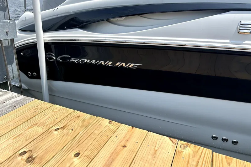Slide: The Image of Control panel of a 2012 Crownline 260 CR boat with switches and voltmeter. - 15