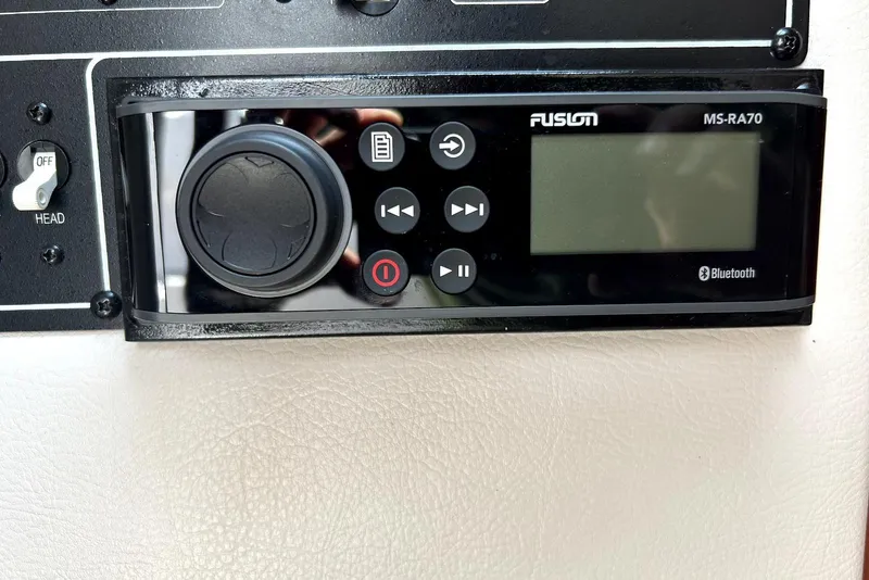 Slide: The Image of Interior view of 2012 Crownline 260 CR boat, showing cabin entrance and seating area. - 16