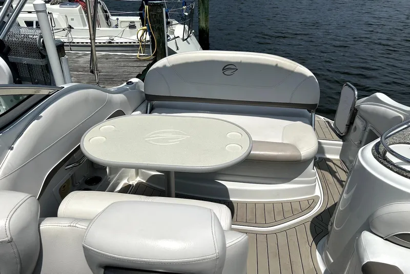 Slide: The Image of 2012 Crownline 260 CR boat interior with luxurious seating and modern dashboard. - 4