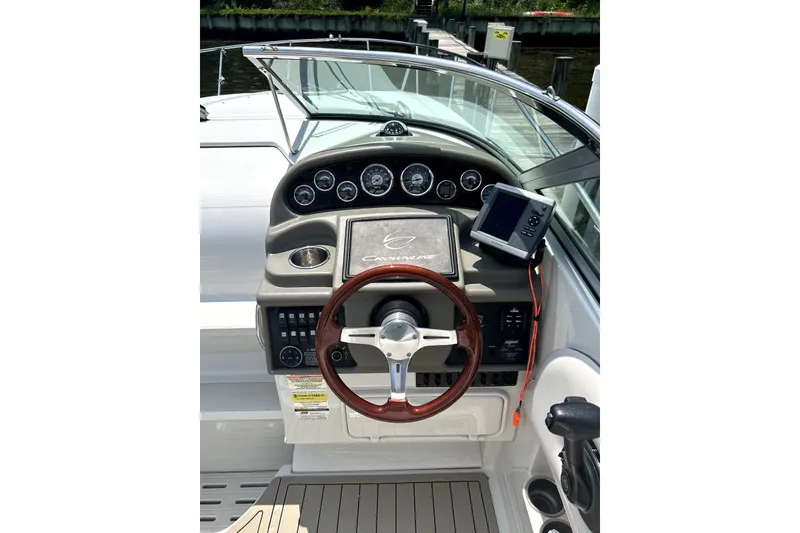 Slide: The Image of Interior of 2012 Crownline 260 CR boat with seating and sink. - 7
