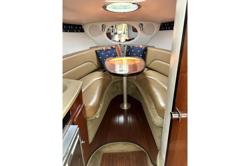 Slide: The Image of 2012 Crownline 260 CR boat dashboard with steering wheel and navigation instruments. - 9