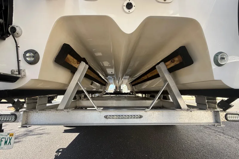 Slide: The Image of Underneath view of a 2019 Calcutta 263 boat on a trailer. - 13