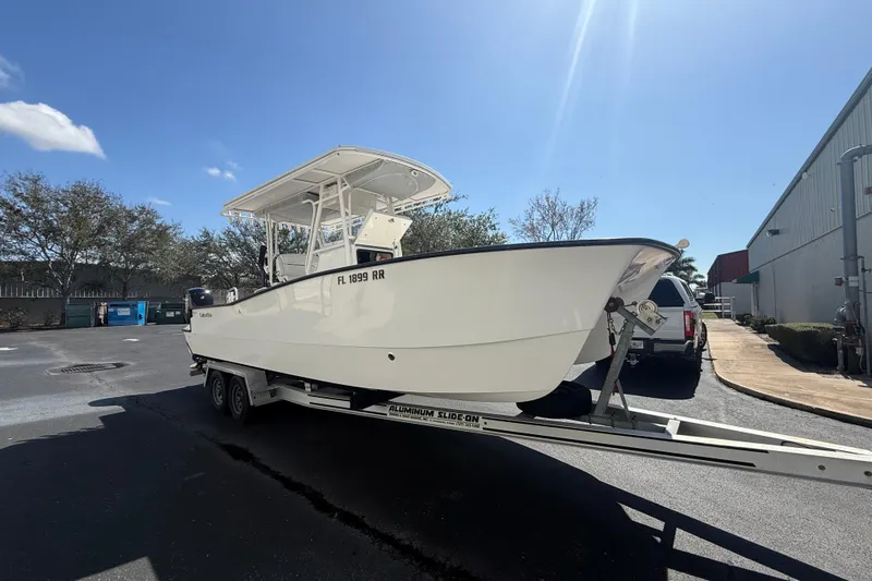 Slide: The Image of 2019 Calcutta 263 boat on trailer in sunny outdoor setting. - 21