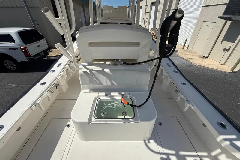 Slide: The Image of 2019 Calcutta 263 boat interior with fishing rod holders and storage compartment. - 26