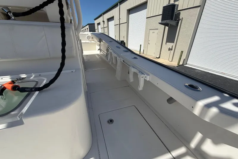 Slide: The Image of 2019 Calcutta 263 boat interior with rod holders and storage compartments. - 29