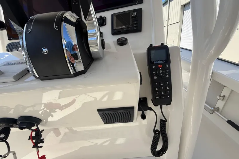Slide: The Image of Control panel of a 2019 Calcutta 263 boat with Simrad radio equipment. - 34