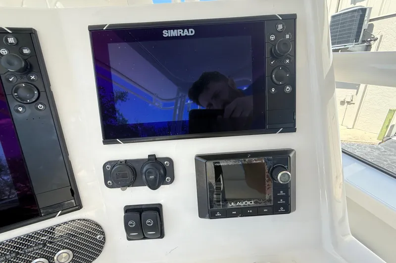 Slide: The Image of Boat dashboard with Simrad display and JL Audio system, Calcutta 263, 2019 model. - 35