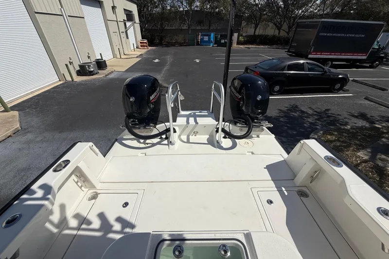 Slide: The Image of 2019 Calcutta 263 boat with dual Mercury engines in a parking lot. - 37