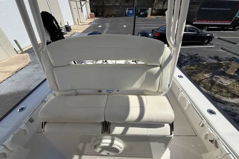 Slide: The Image of White seating on a 2019 Calcutta 263 boat, parked in a lot. - 38