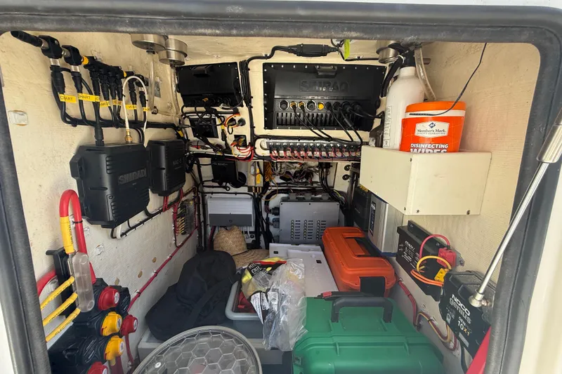 Slide: The Image of Electrical equipment setup inside a Calcutta 263 model, featuring organized wiring and storage. - 40