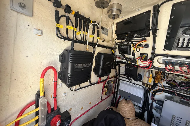 Slide: The Image of Electrical system setup in a 2019 Calcutta 263 boat, featuring Simrad equipment and organized wiring. - 41