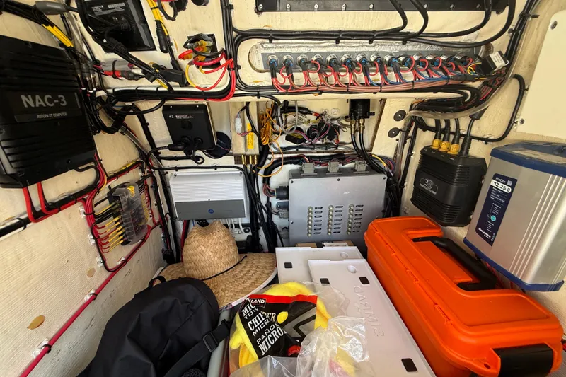 Slide: The Image of Electrical system setup in a 2019 Calcutta 263 boat, featuring wiring and equipment. - 43