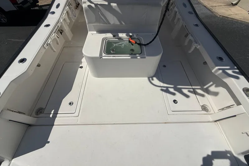Slide: The Image of 2019 Calcutta 263 boat deck with storage compartments and fishing rod holders. - 58