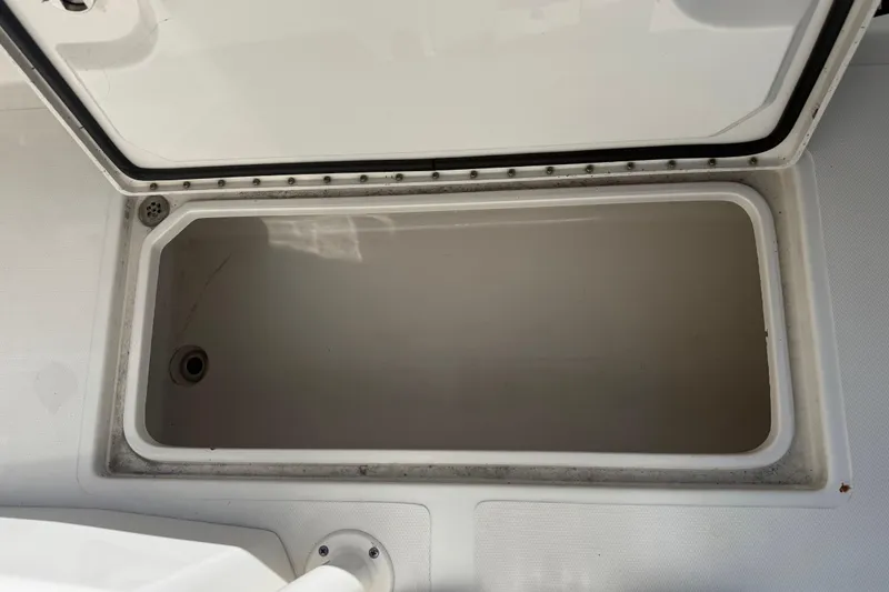 Slide: The Image of Open storage compartment on 2019 Calcutta 263 boat, showing interior space. - 66