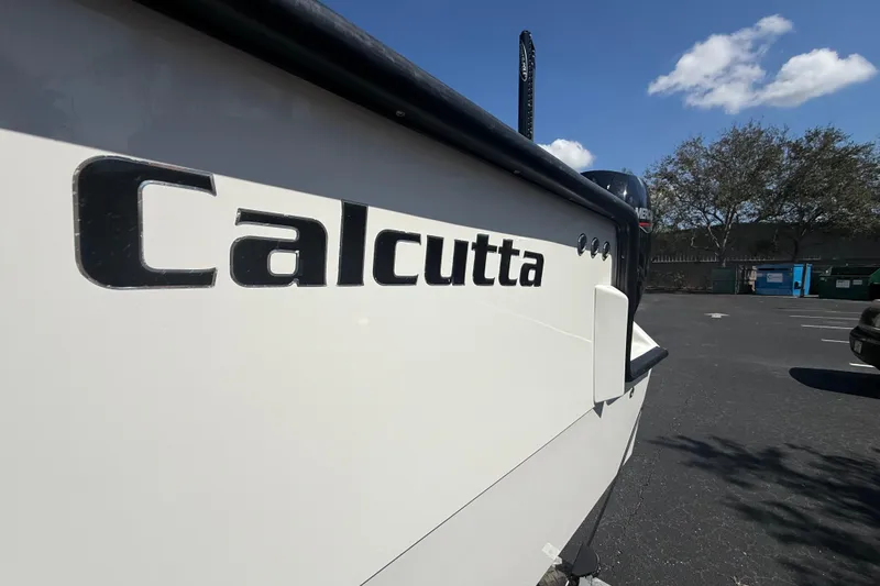 Slide: The Image of 2019 Calcutta 263 boat in parking lot under blue sky. - 8