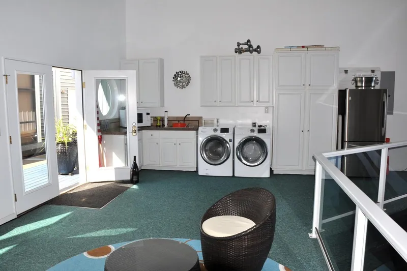 Slide: The Image of Interior of 2004 Steelhead Marine Boat House with laundry area and modern appliances. - 10