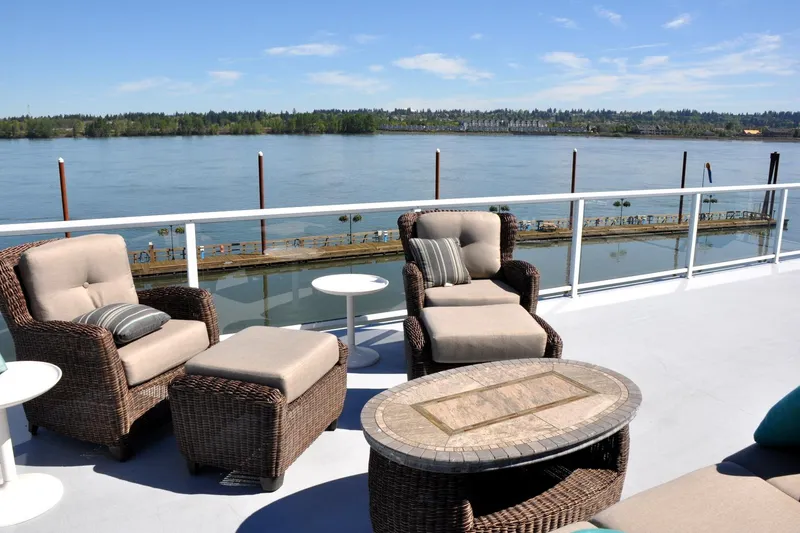 Slide: The Image of Outdoor seating on Steelhead Marine Boat House, overlooking serene river view, 2004 model. - 23