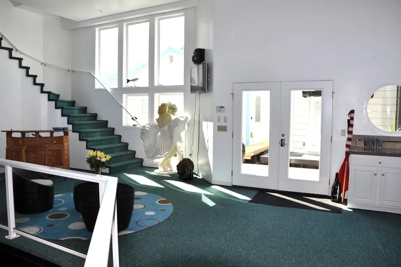 Slide: The Image of Spacious interior of 2004 Steelhead Marine Boat House with modern decor and large windows. - 26