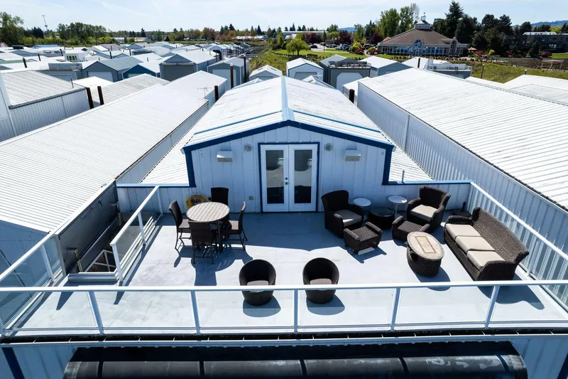 Slide: The Image of Rooftop patio on Custom 103 Boat House, 2004, with outdoor seating and scenic views. - 28