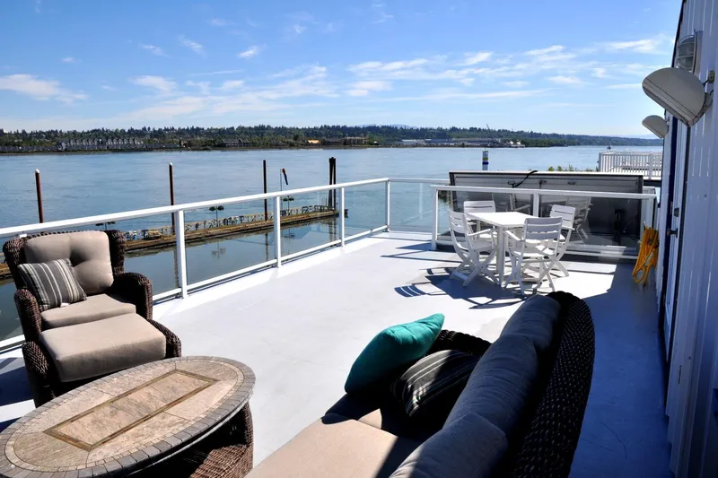 Slide: The Image of Riverside view from Steelhead Marine Boat House, 2004, with outdoor seating and dining area. - 4