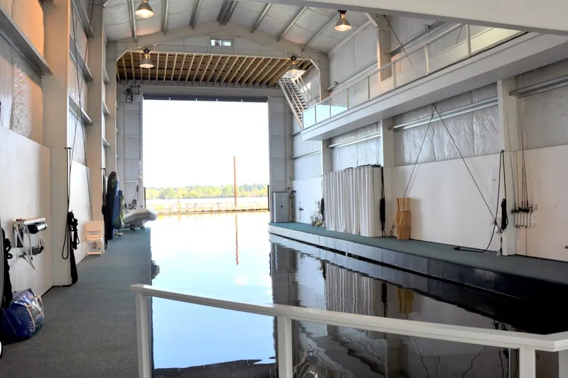 Slide: The Image of Interior of a 2004 Steelhead Marine Boat House with waterway and equipment. - 5