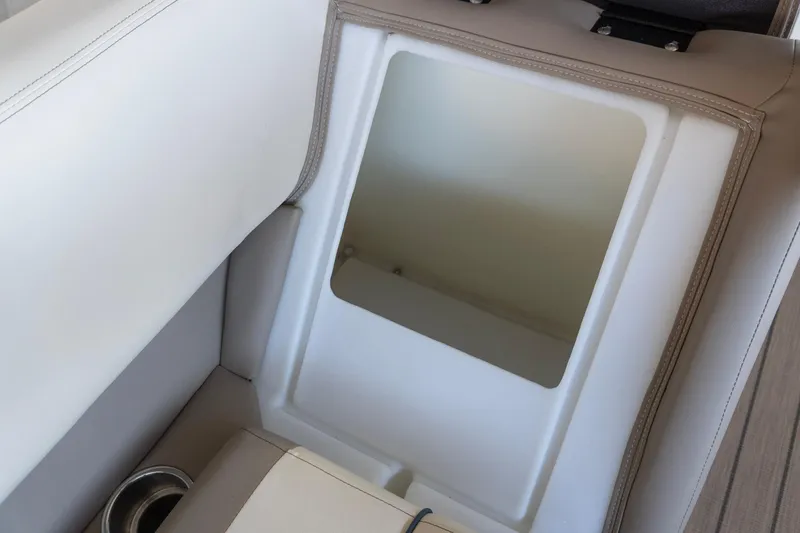 Slide: The Image of 2026 SunCatcher Select 322RC boat seat storage compartment with cup holder. - 12