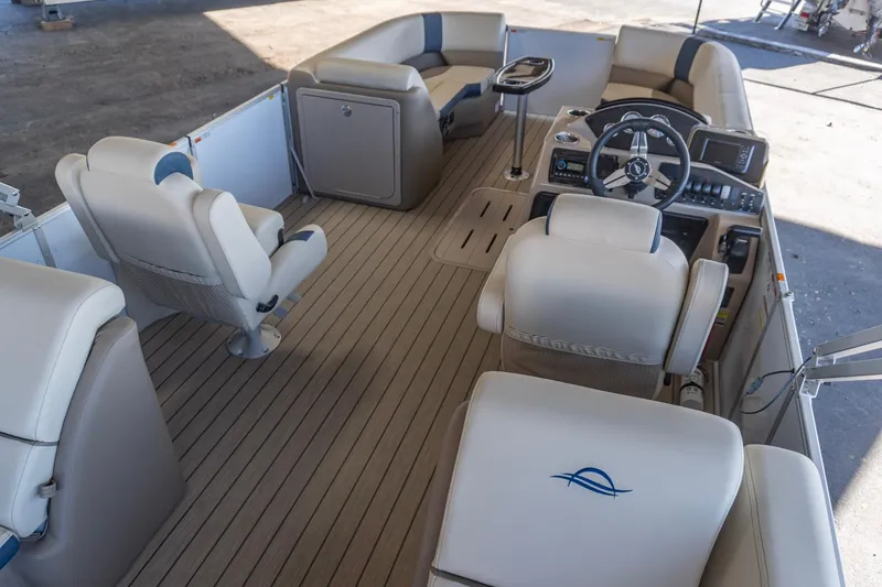 Slide: The Image of Luxurious interior of 2026 SunCatcher Select 322RC pontoon boat with plush seating and modern controls. - 13