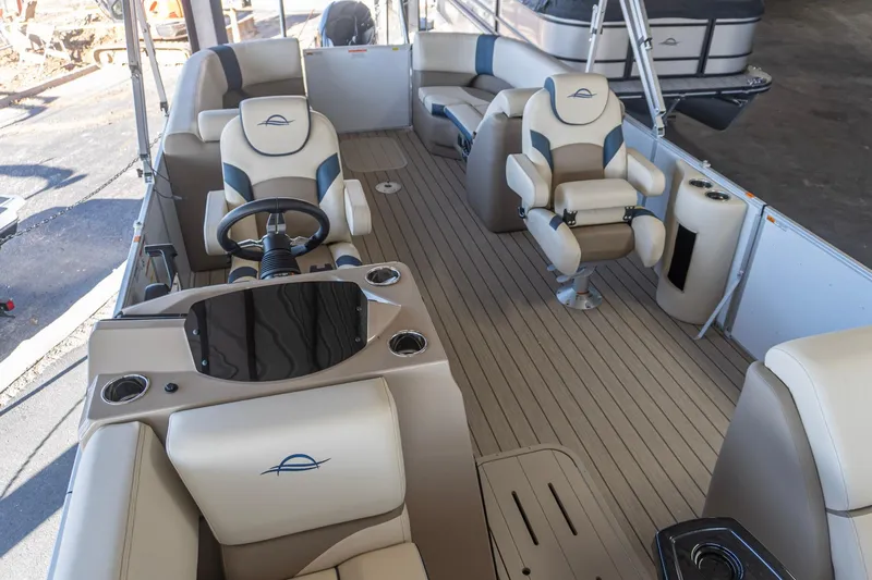 Slide: The Image of 2026 SunCatcher Select 322RC boat interior with luxurious seating and modern steering console. - 3