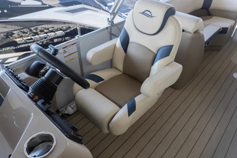 Slide: The Image of Captain's chair on 2026 SunCatcher Select 322RC boat, featuring luxurious beige and navy design. - 5