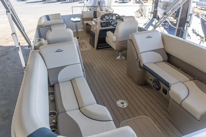 Slide: The Image of Luxurious 2026 SunCatcher Select 322RC pontoon boat interior with plush seating and modern dashboard. - 7