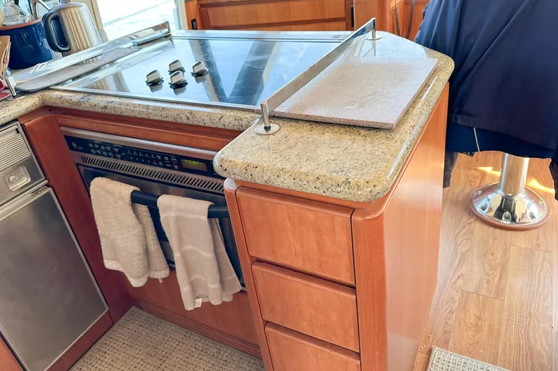 Slide: The Image of 2004 West Bay Sonship yacht kitchen with granite countertops and modern appliances. - 10