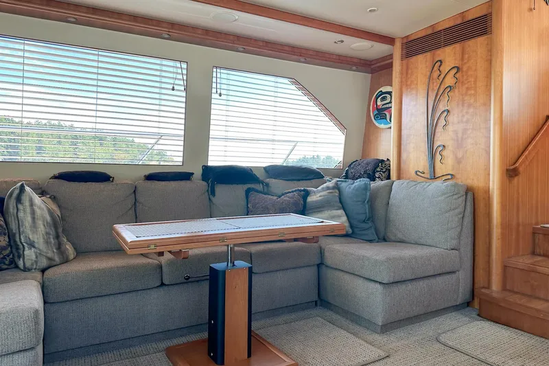 Slide: The Image of Luxurious 2004 West Bay Sonship yacht interior with plush seating and elegant wooden accents. - 14