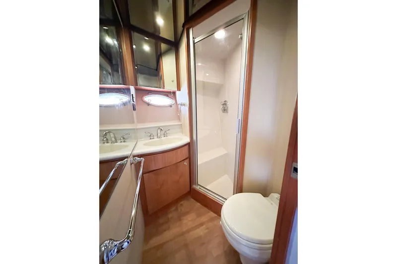 Slide: The Image of Luxurious bathroom in 2004 West Bay Sonship yacht with shower, sink, and toilet. - 25