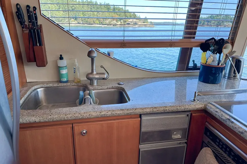 Slide: The Image of Kitchen area of 2004 West Bay Sonship yacht with ocean view through window. - 9